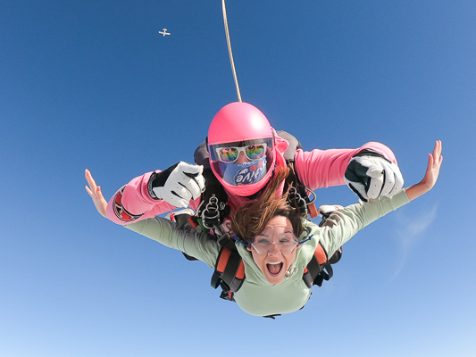 Female tandem skydiving